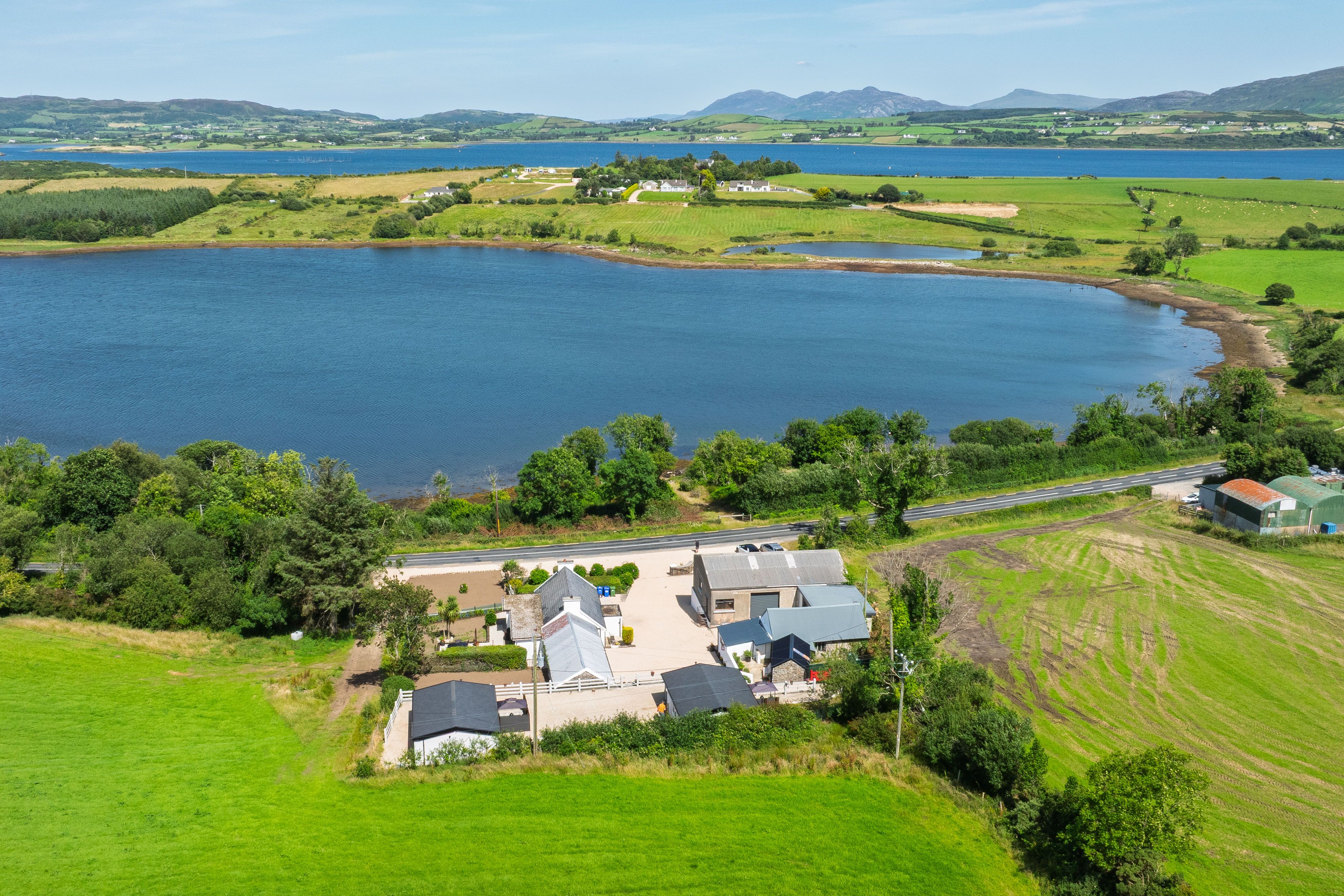 Aerial view over the whole property to Mulroy Bay and the mountains beyond