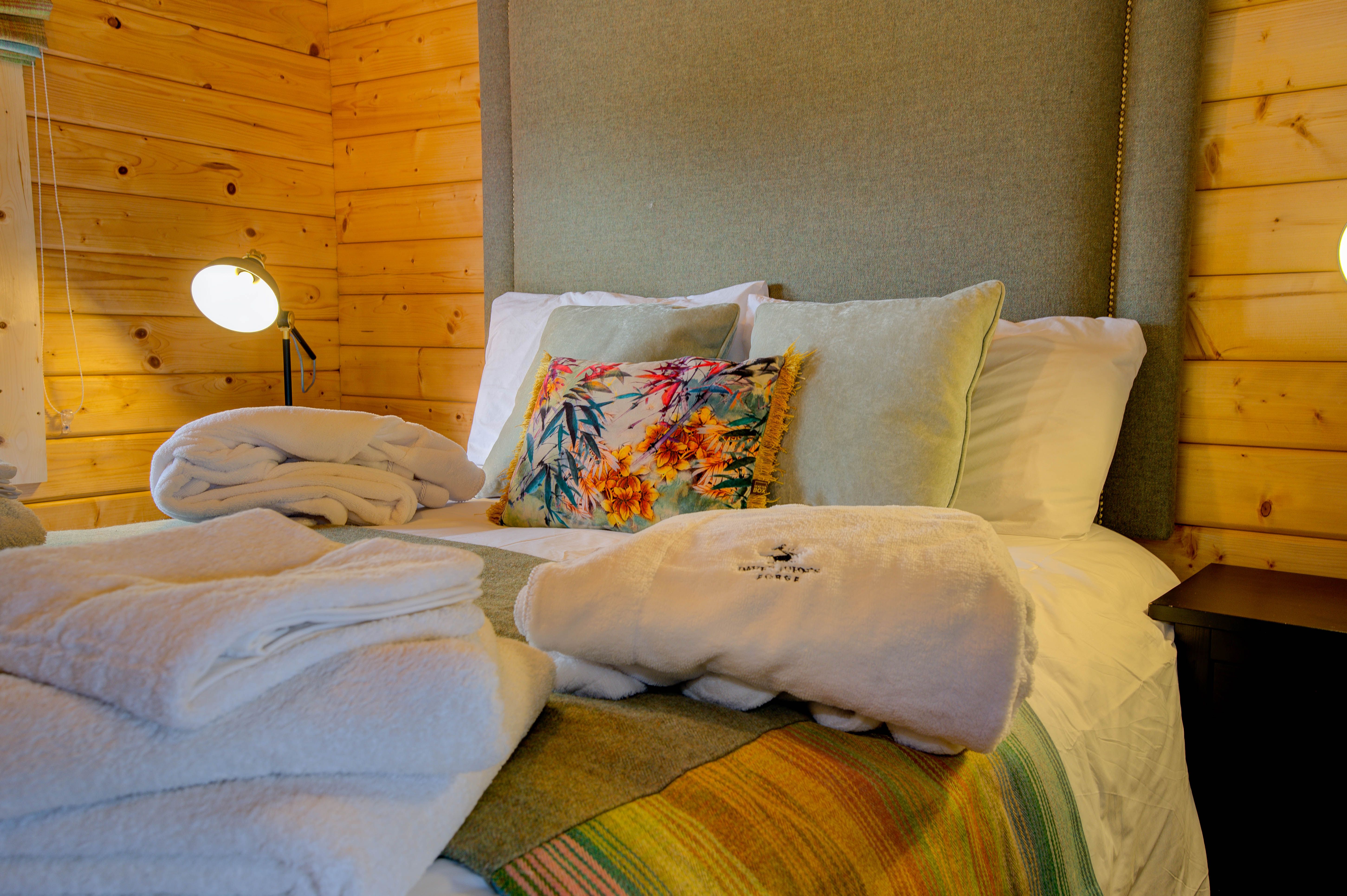 Rae’s king-size bed with the McNutt of Donegal sage tweed headboard
