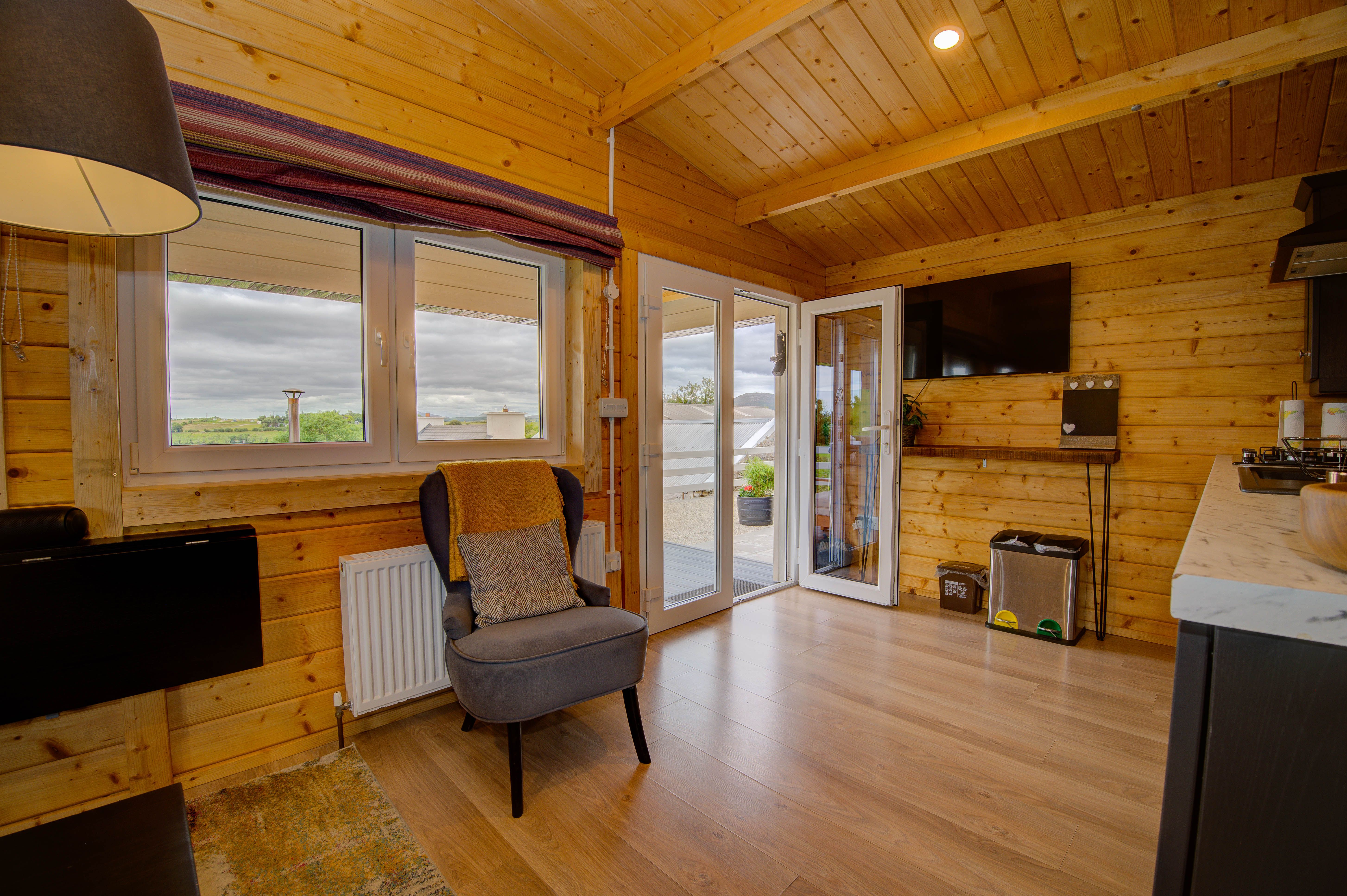 Margaret’s armchair by the open French doors, the hot tub on the deck beyond