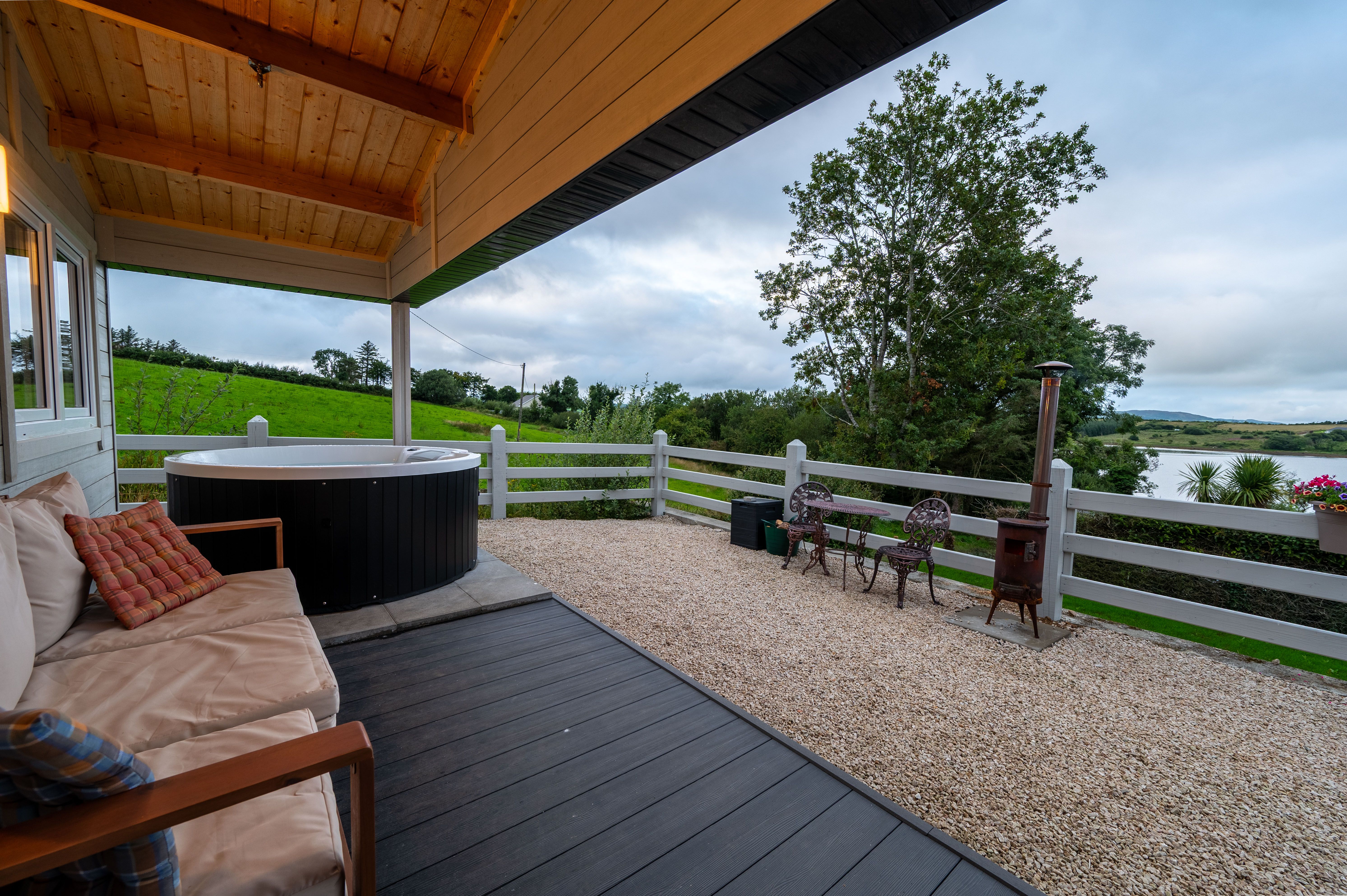 Margaret’s hot-tub deck with the lawn and Mulroy Bay beyond
