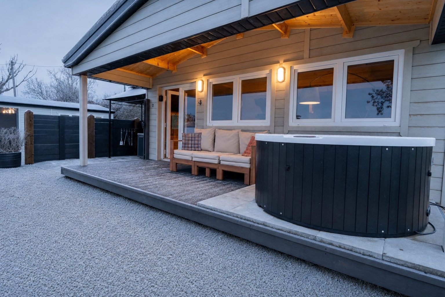 The covered deck and hot tub at Margaret’s Cabin on a frosty winter dusk