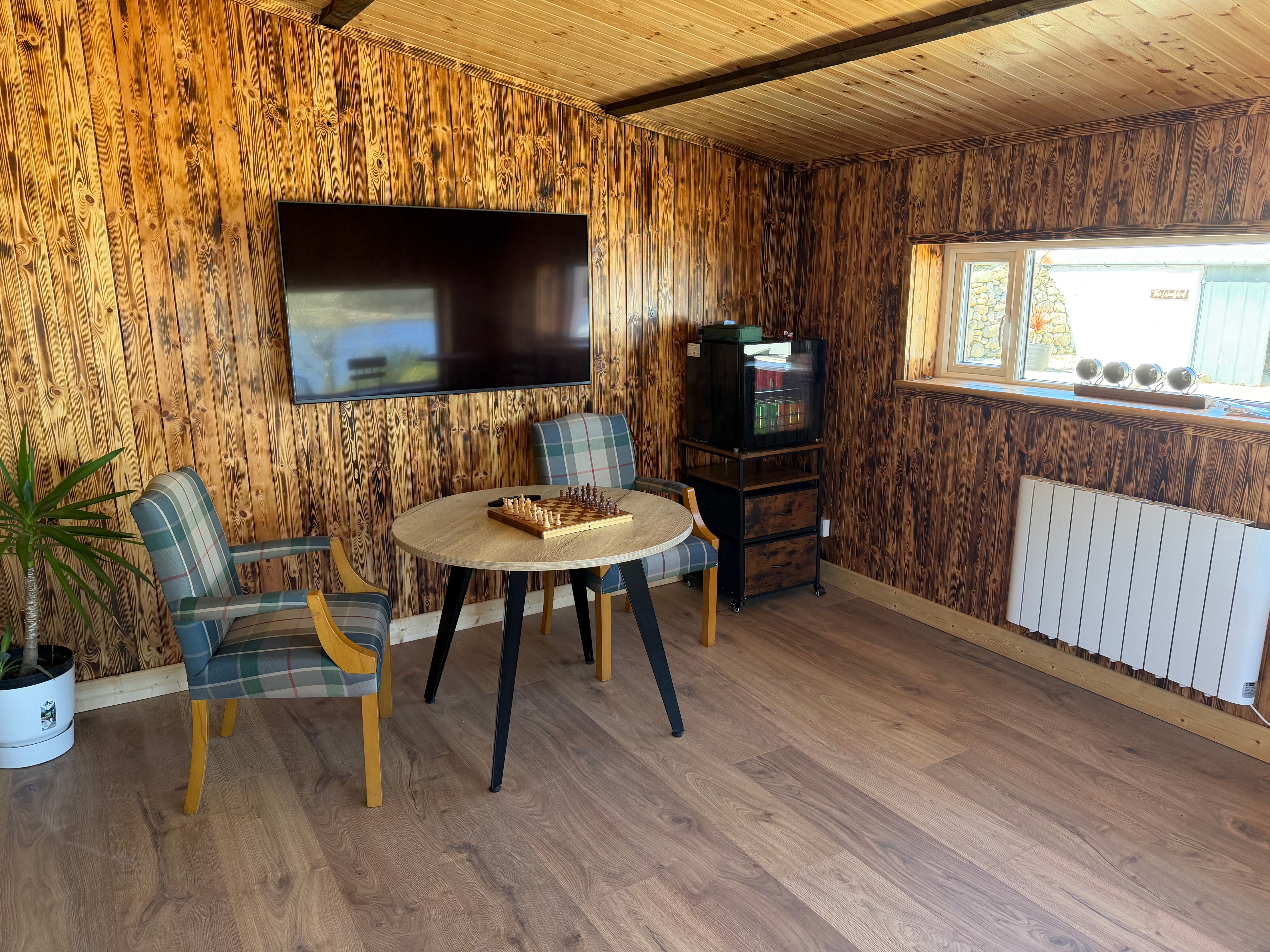 The games room looking out over the woodshed and courtyard