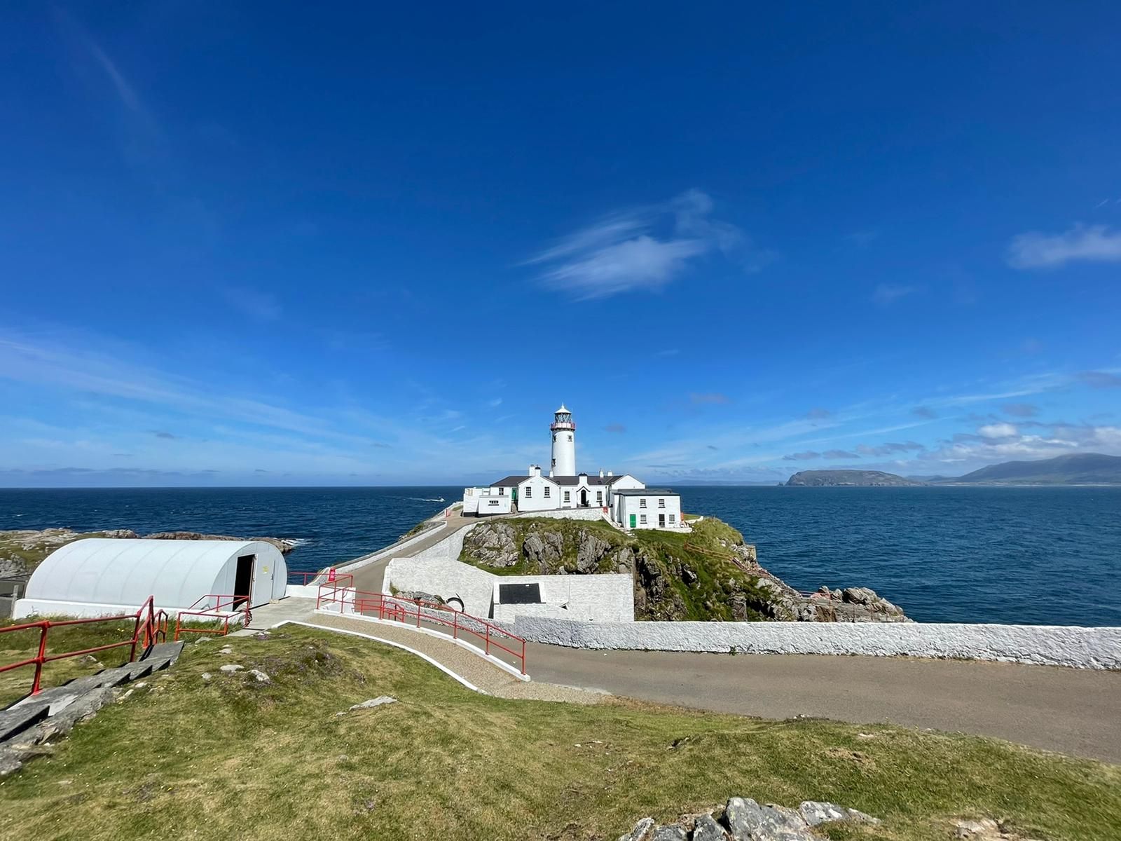 Fanad Head Lighthouse on its headland above the sea