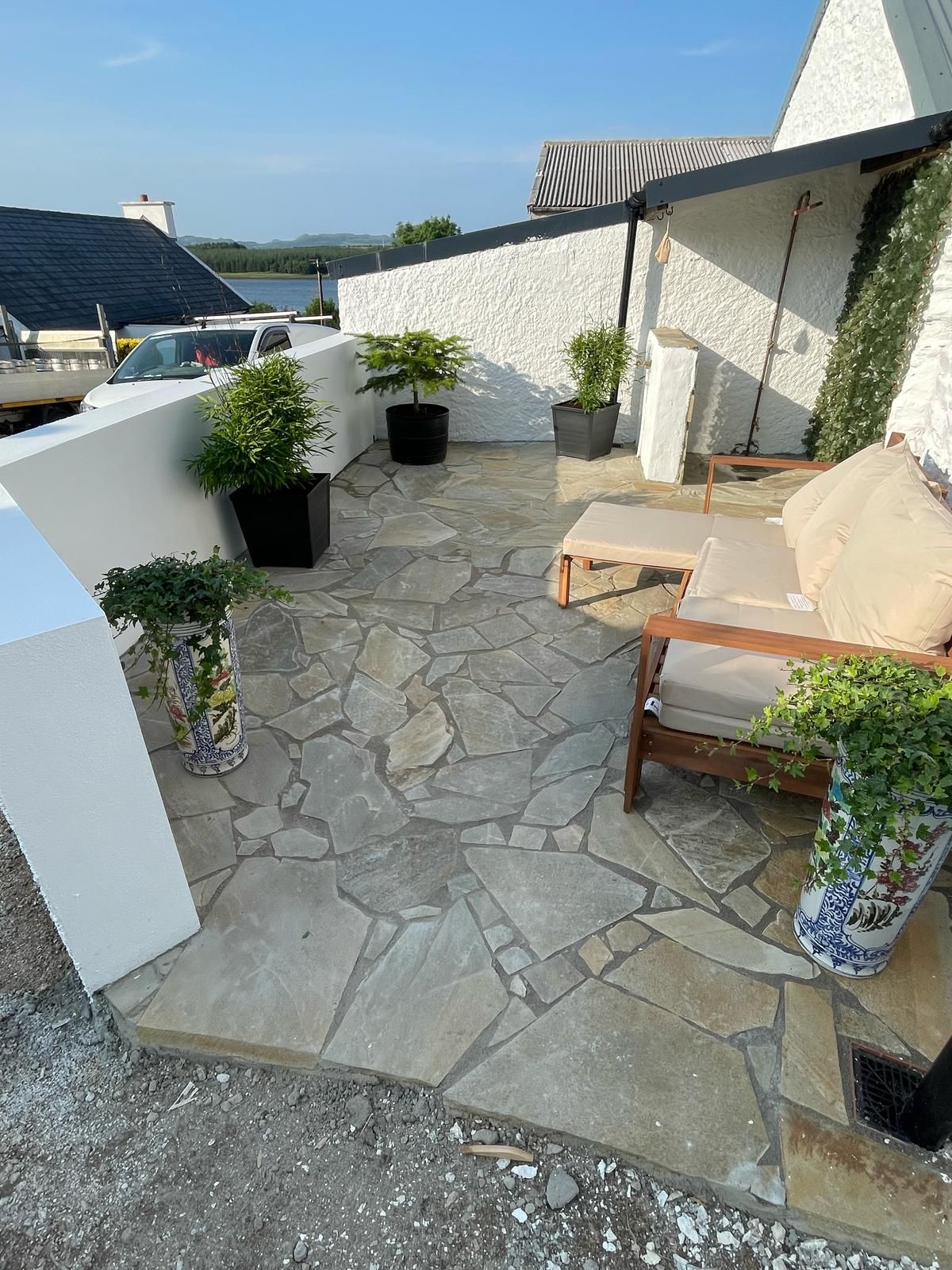 The finished sauna terrace in Donegal Quartz crazy paving, looking down to Mulroy Bay.